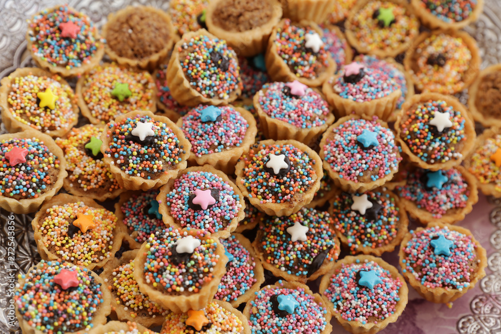 Mixed Christmas cookies, Colorful mix of Christmas-themed decorated cookies Mixed Christmas cookies, Colorful mix of Christmas-themed decorated cookies