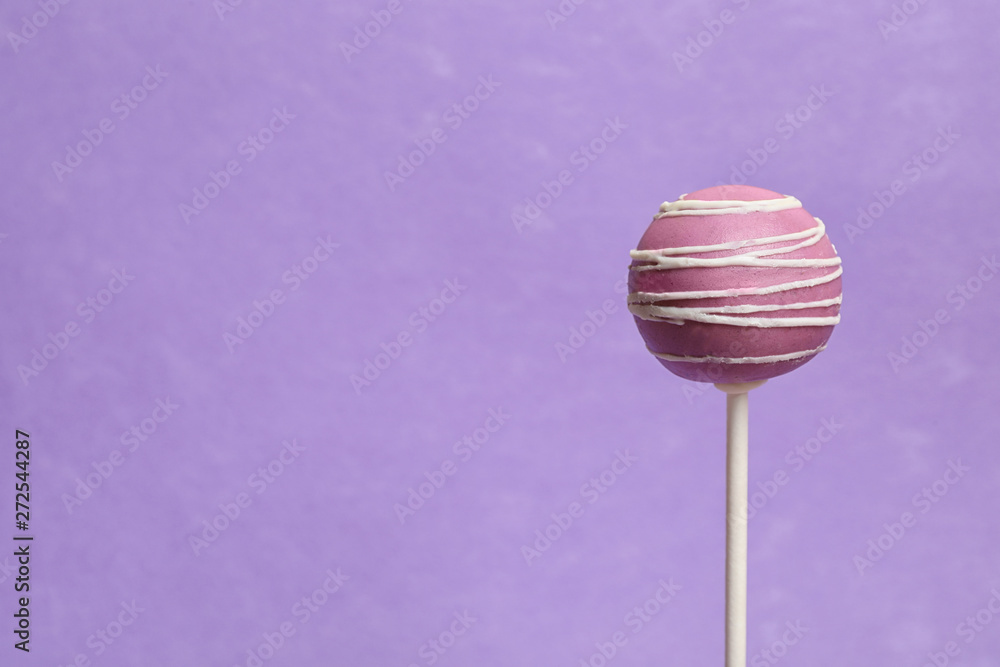 Bright delicious cake pop on color background. Space for text Bright delicious cake pop on color background. Space for text
