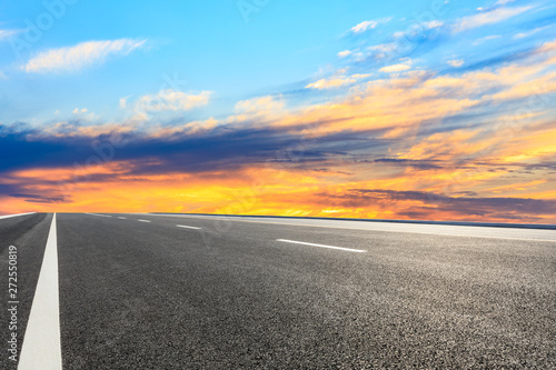 Asphalt road and sunset sky © ABCDstock