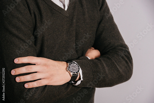 A man with a watch on his arm. Model