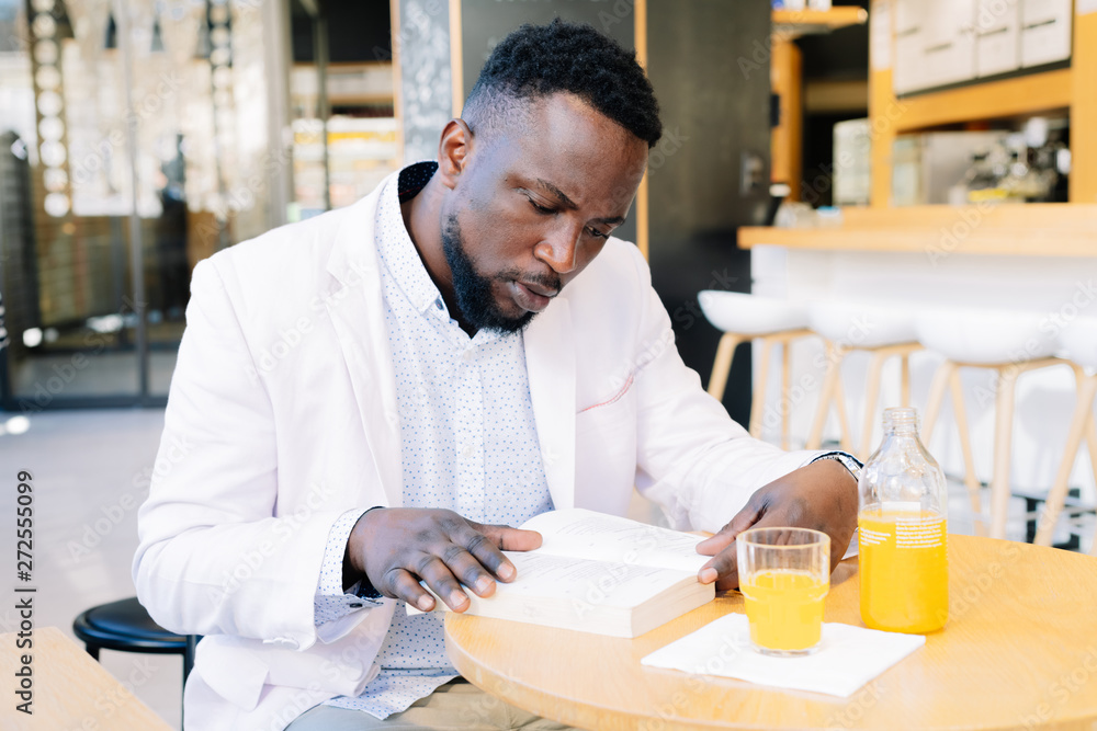 Man reading from a coffee shop Man reading from a coffee shop