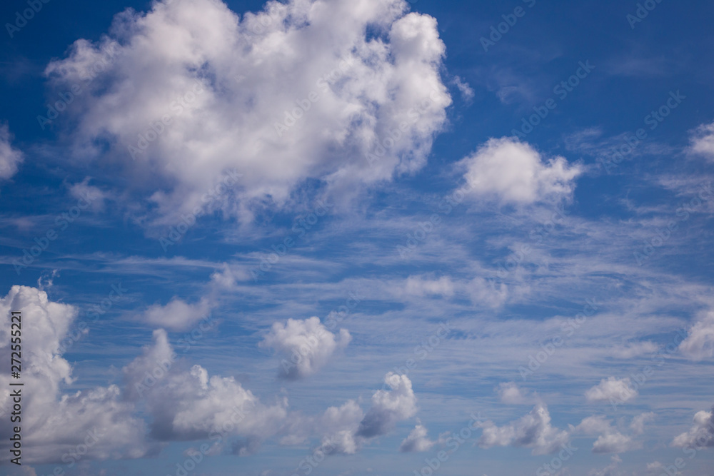 White fluffy clouds with a beautiful blue sky White fluffy clouds with a beautiful blue sky