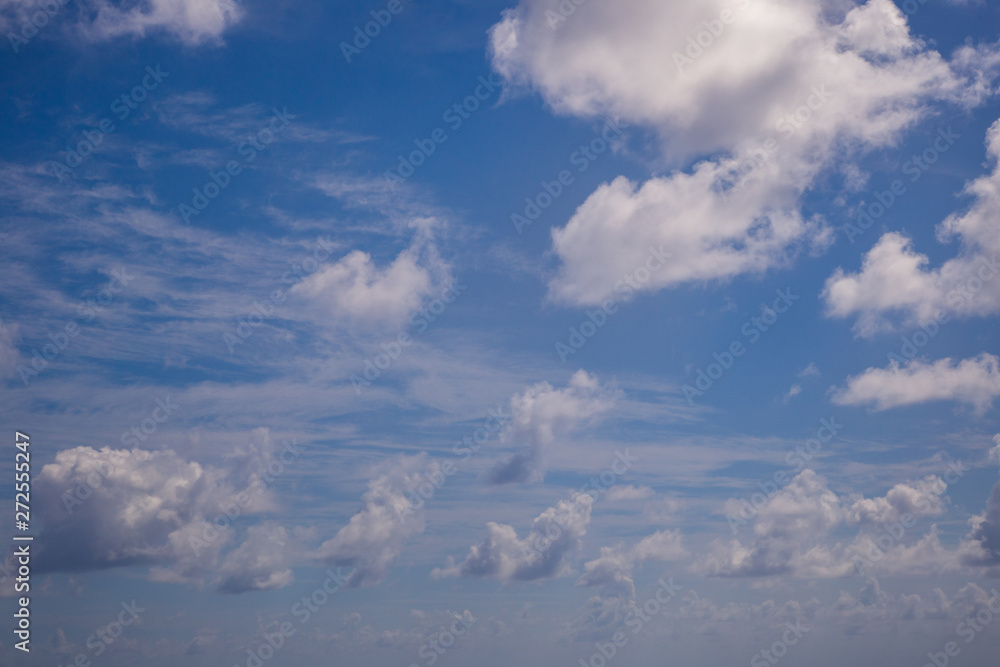 Fototapeta premium White fluffy clouds with a beautiful blue sky