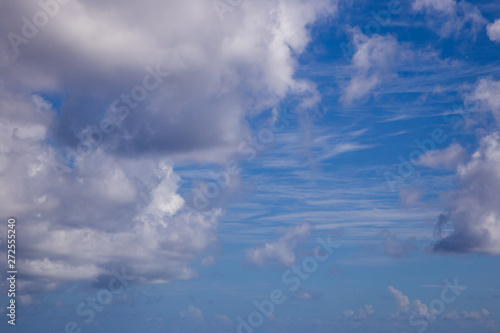White fluffy clouds with a beautiful blue sky © John