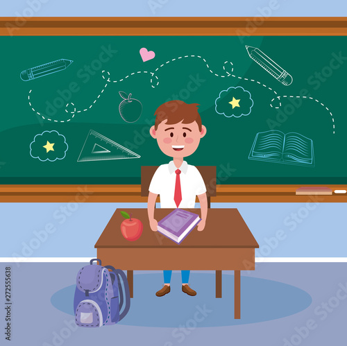 boy student with apple fruit and book in the desk