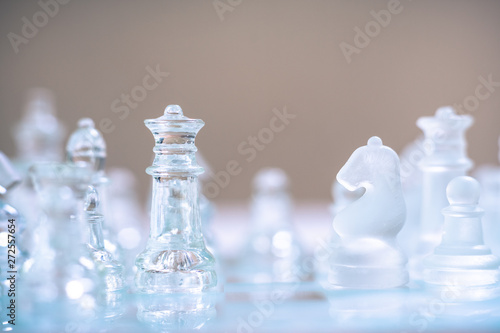 Chess board game made of glass, business competitive concept