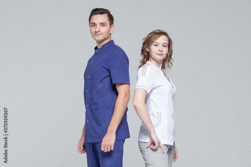 Portrait of young male and female doctors standing together Portrait of young male and female doctors standing together