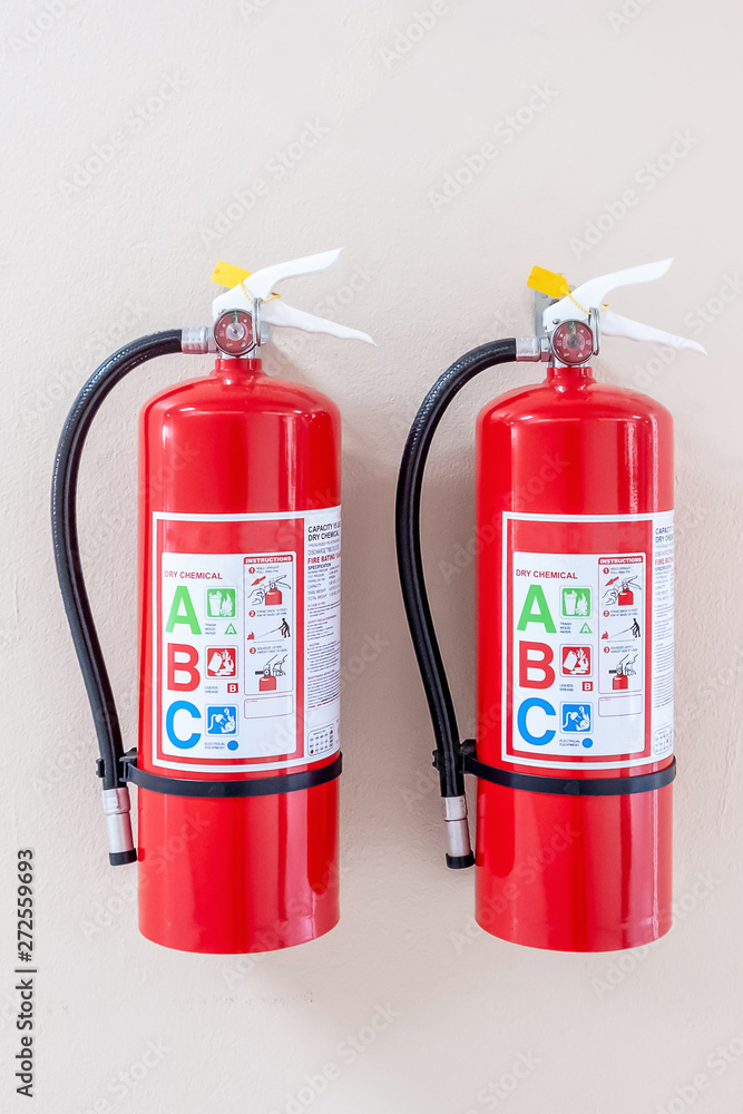 Obraz premium Fire extinguisher system on the wall background, powerful emergency equipment for industrial