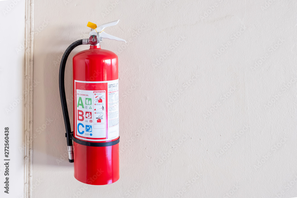 Fire extinguisher system on the wall background, powerful emergency equipment for industrial Fire extinguisher system on the wall background, powerful emergency equipment for industrial
