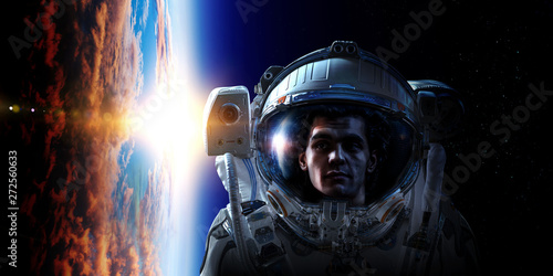 Fototapeta Naklejka Na Ścianę i Meble -  Spaceman and planet, human in space concept