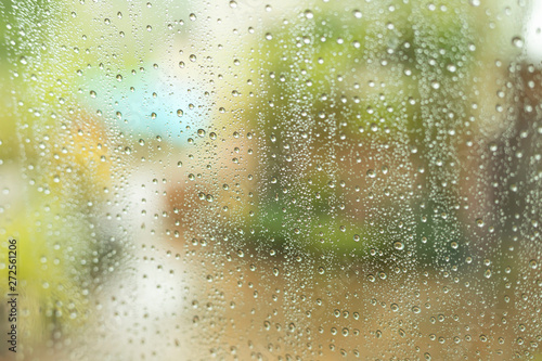 Rain drops on the glass, blurred background