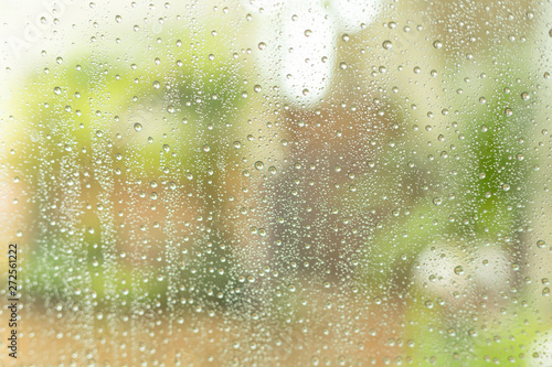 Rain drops on the glass, blurred background