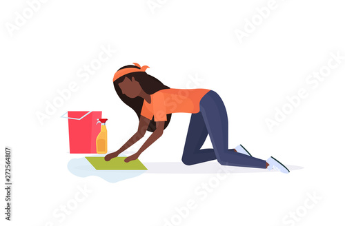 housewife washing floor on knees african american woman cleaner using cloth and bucket girl doing housework cleaning service concept full length flat white background