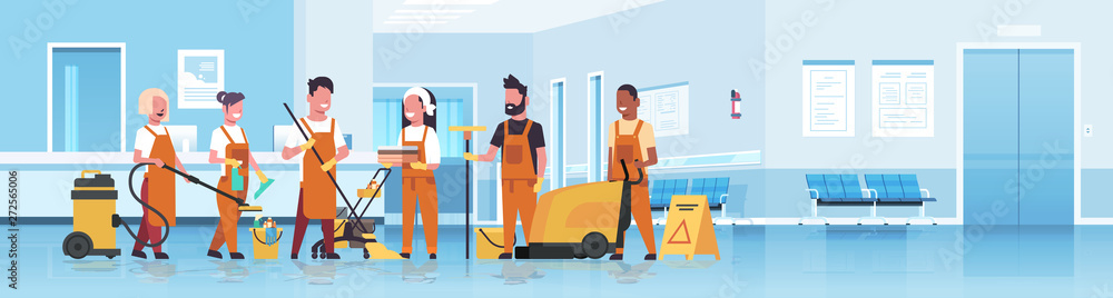 janitors team cleaning service concept mix race cleaners in uniform working together with professional equipment hospital reception interior flat full length horizontal copy space - obrazy, fototapety, plakaty 