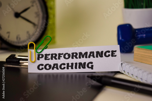 Performance Coaching on the paper isolated on it desk. Business and inspiration concept