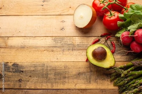 Fresh set of vegetables on a wooden background with space. Colorful background. Vegetarian sets. Harvest. Gastronomy