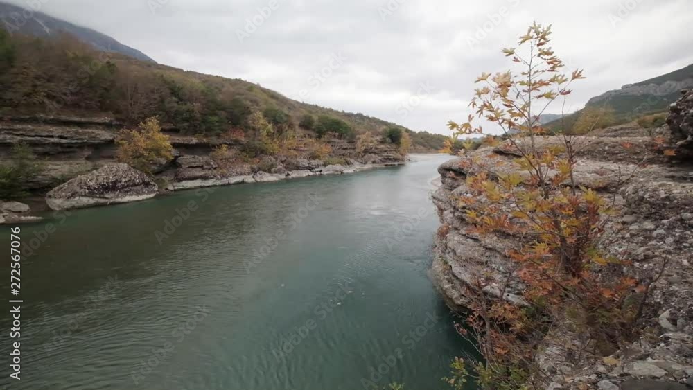 Vjose River in Albania during the autumn season. Permet river and the beautiful colour Vjose River in Albania during the autumn season. Permet river and the beautiful colour