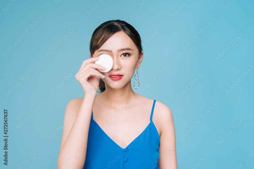 Beautiful woman with cotton pad, smiling Beautiful woman with cotton pad, smiling