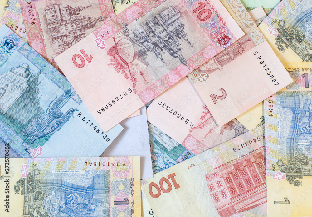 Obraz premium Hryvnia paper bill. Notes in denominations of one, two, five, ten, twenty, fifty and one hundred hryvna. Uah. Cash. Background texture. Ukrainian money.