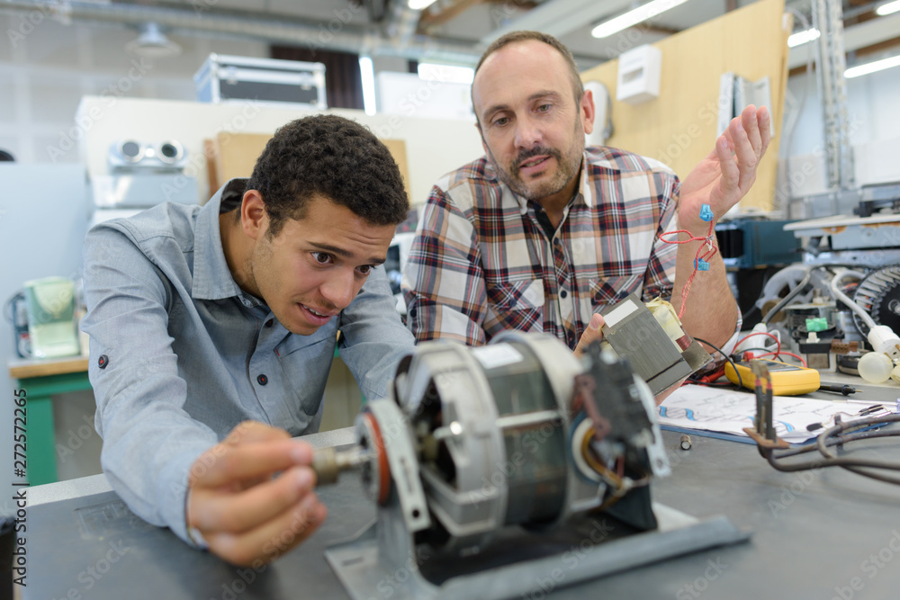 scientist controlling a robot scientist controlling a robot