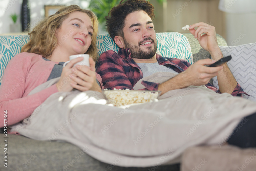 young couple relaxing in their apartment young couple relaxing in their apartment