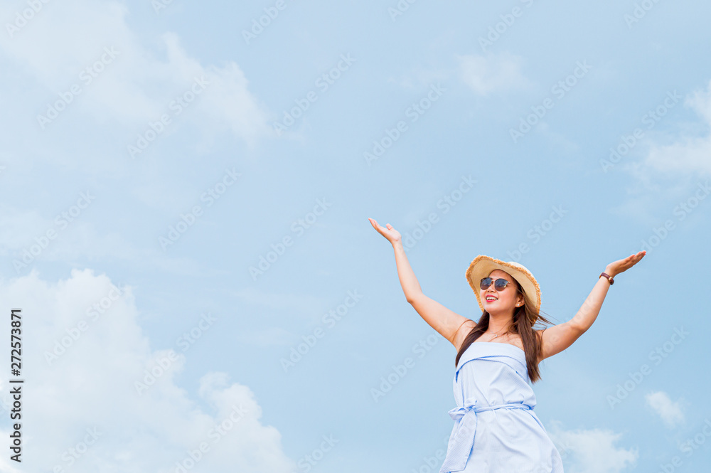 Summer concept travel,Young asian woman with hat on the beach with sunny day in Thailand,Summer concept background. Summer concept travel,Young asian woman with hat on the beach with sunny day in Thailand,Summer concept background.