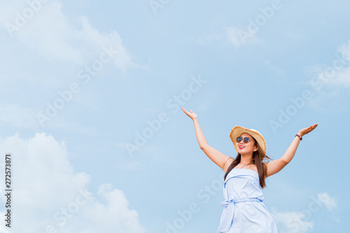 Summer concept travel,Young asian woman with hat on the beach with sunny day in Thailand,Summer concept background.