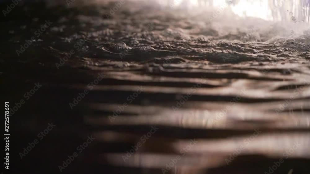A close up of water ripples in a water fountain. Night shot. A close up of water ripples in a water fountain. Night shot.