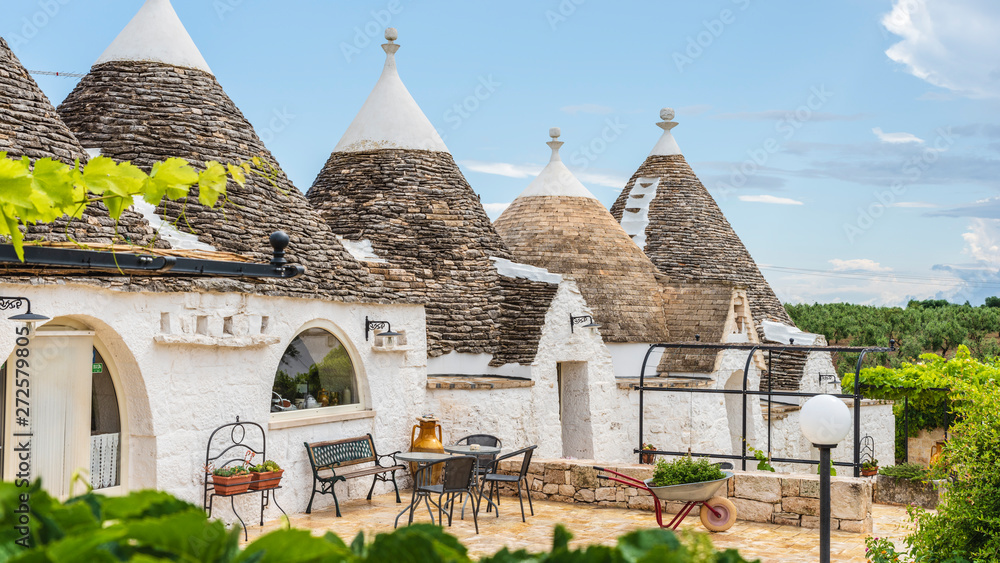 Fototapeta premium Trulli of the Itria valley. Details in the sky. Puglia, Italy.