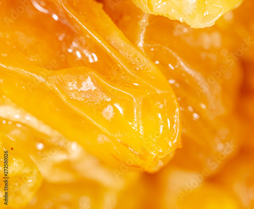 Yellow raisins as background