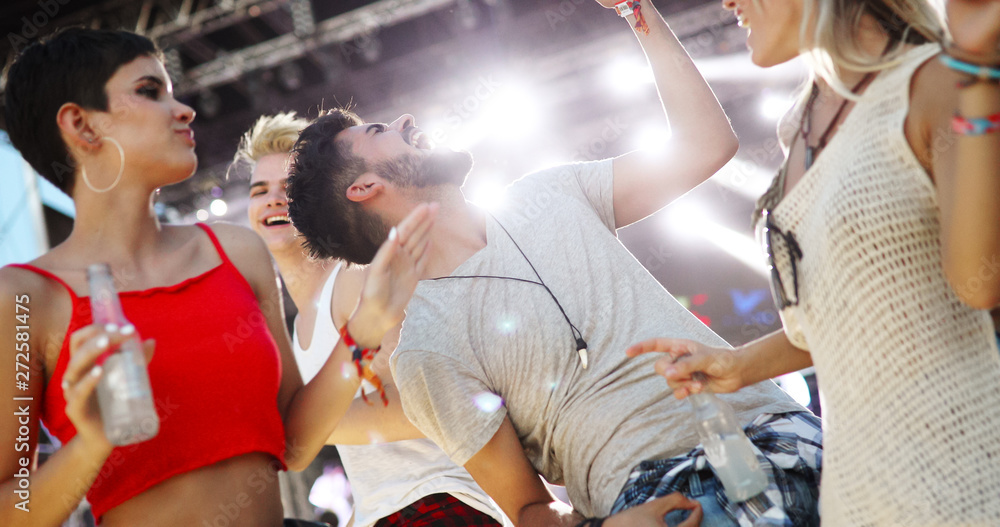 Fototapeta premium Group of friends having fun time at music festival