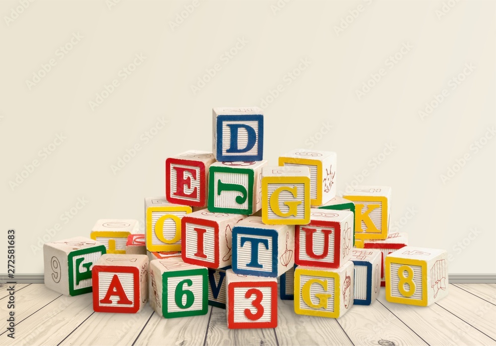 Colorful cubes and Toys collection on wooden table with blurred background Colorful cubes and Toys collection on wooden table with blurred background