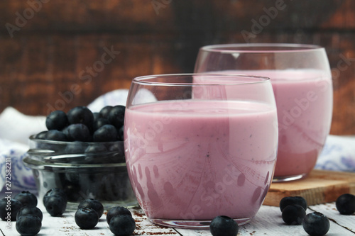 Two glasses with blueberry yogurt 