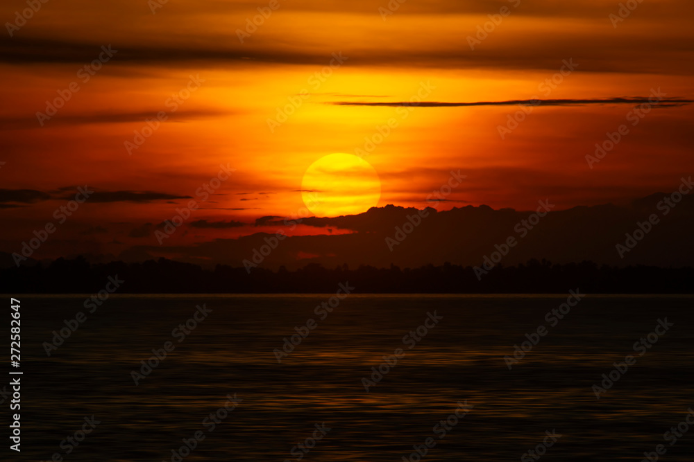 Fototapeta premium Sunset sky with silhouette cloud and mountain