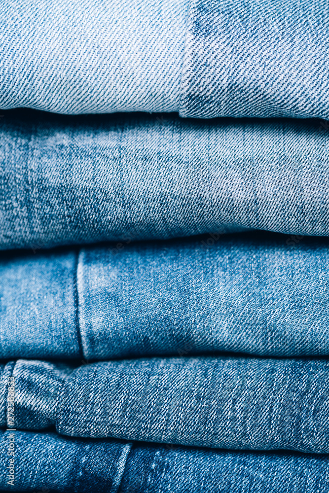 Stack of jeans on table. Zero vaste concept. Ecology and recycling. Stack of jeans on table. Zero vaste concept. Ecology and recycling.