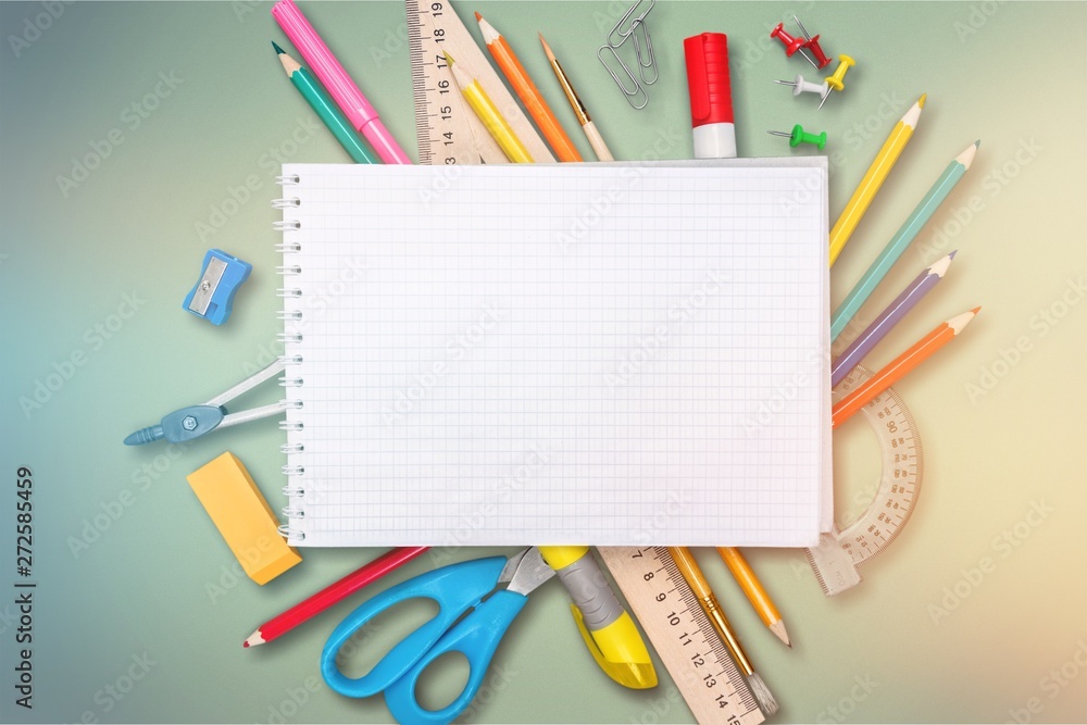 Colorful school supplies on wooden table background Colorful school supplies on wooden table background
