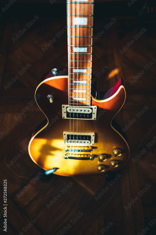 Fototapeta premium Top view of brown electric guitar