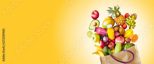 Colorful yellow panorama banner of tropical fruit photo