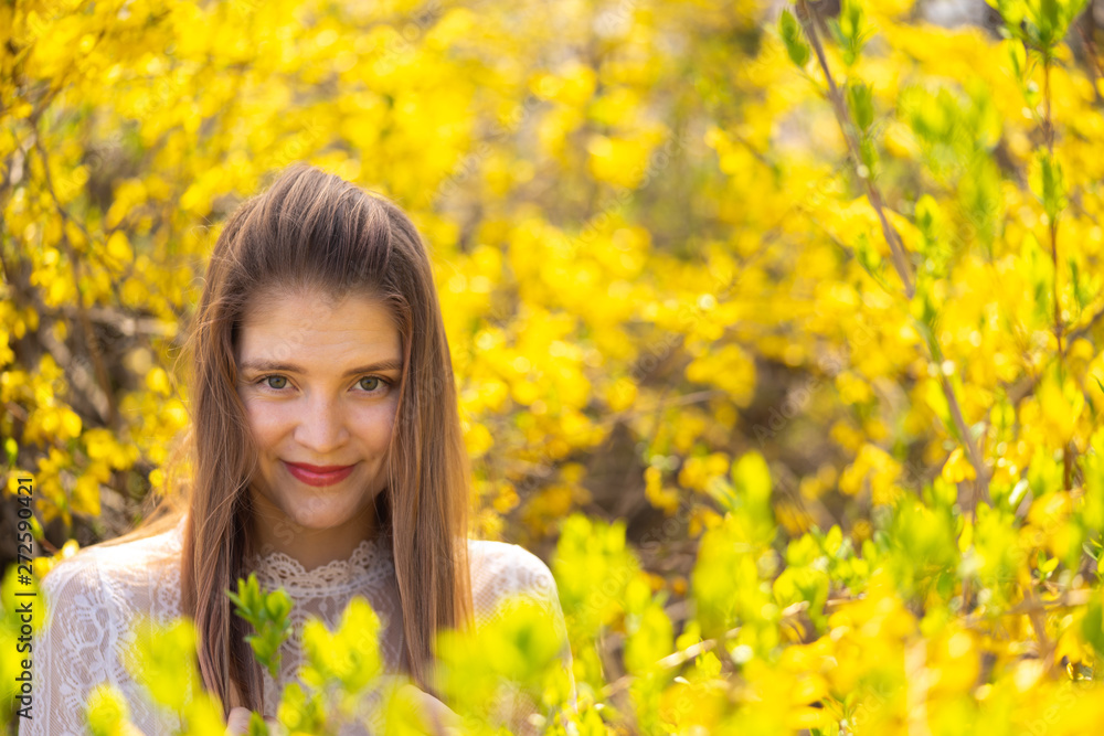 young blond woman in yellow flowers young blond woman in yellow flowers