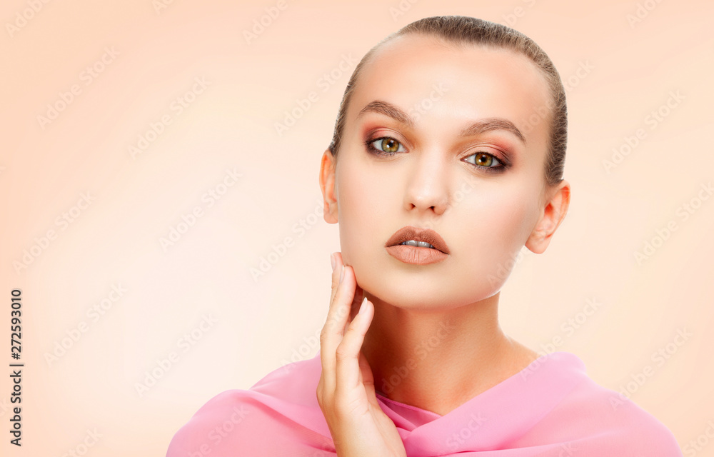 Pretty girl with clean and fresh skin wearing pink tissue on her shoulders. Skin care concept Pretty girl with clean and fresh skin wearing pink tissue on her shoulders. Skin care concept