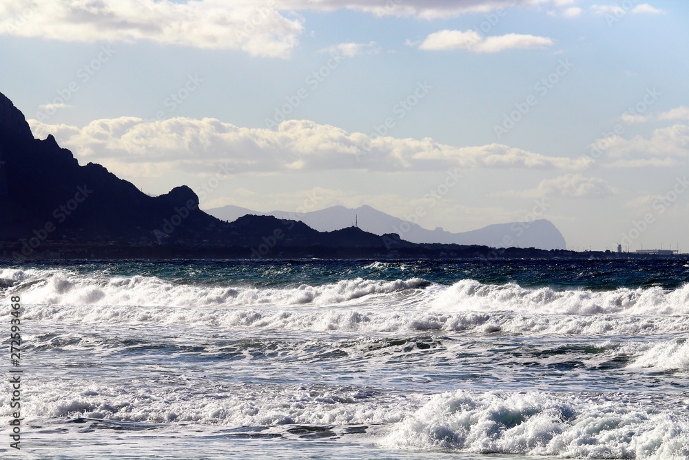 rescue boat on the beach with cape in the background