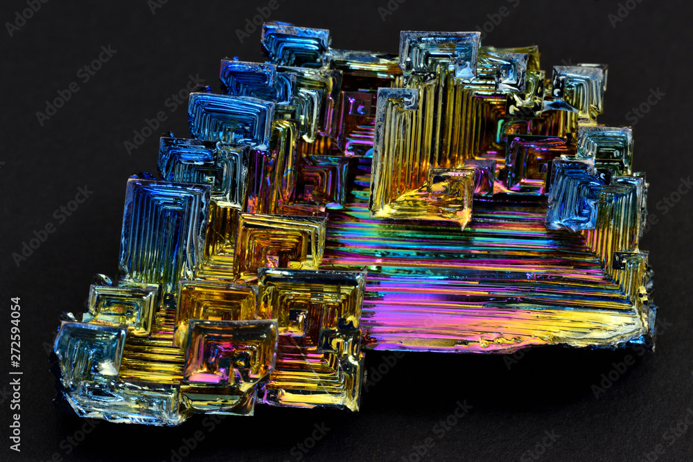 Bismuth crystals on a dark background. This is the most strongly
