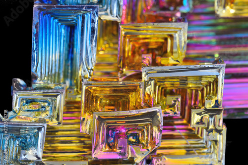 Bismuth crystals on a dark background. This is the most strongly diamagnetic element and also the heaviest that is not radioactive.