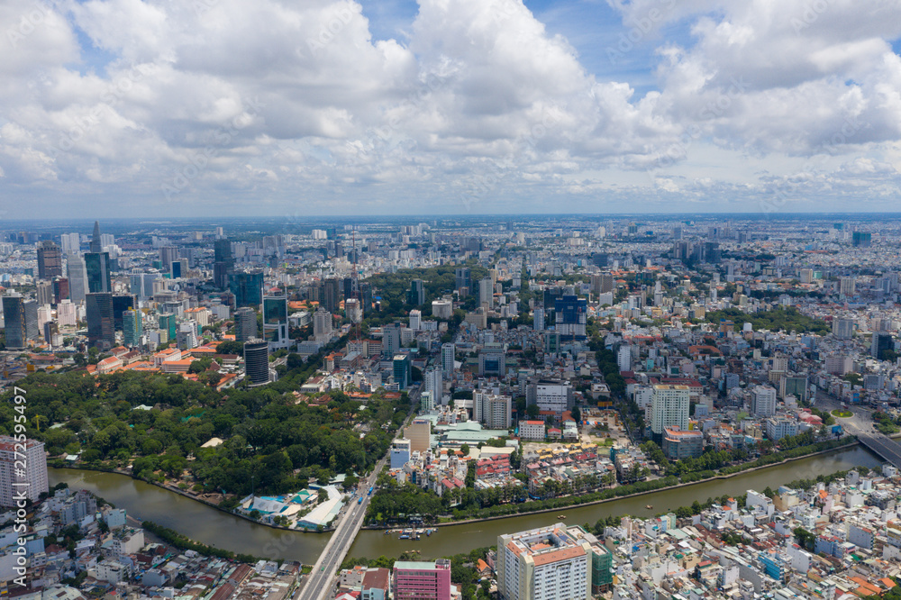 Top View of Building in a City - Aerial view Skyscrapers flying by drone of Ho Chi Mi City with development buildings, transportation, energy power infrastructure. include Landmark 81 and blue sky , Top View of Building in a City - Aerial view Skyscrapers flying by drone of Ho Chi Mi City with development buildings, transportation, energy power infrastructure. include Landmark 81 and blue sky ,