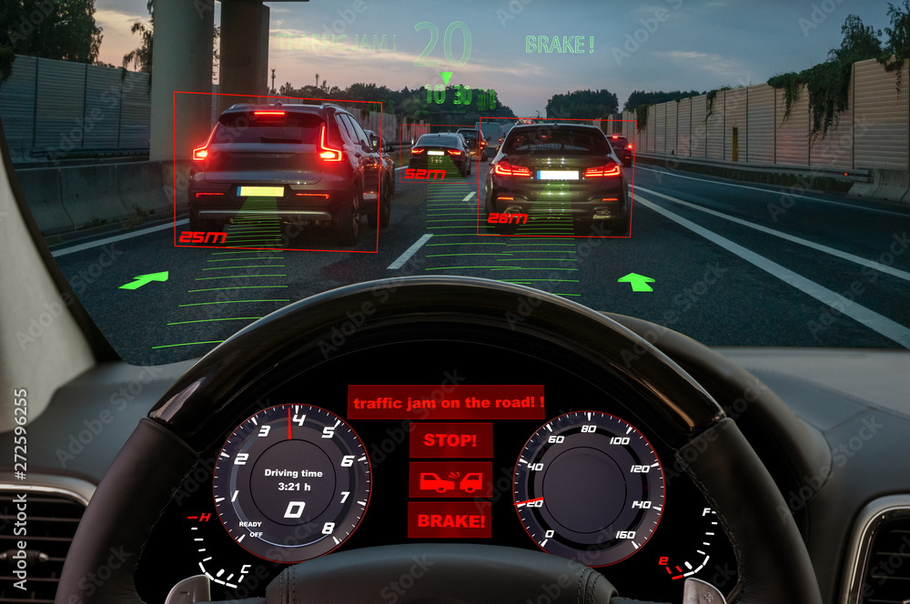 view from the cockpit of a car equipped with HUD and active safety systems.The systems detected a traffic jam on the motorway and activated emergency braking