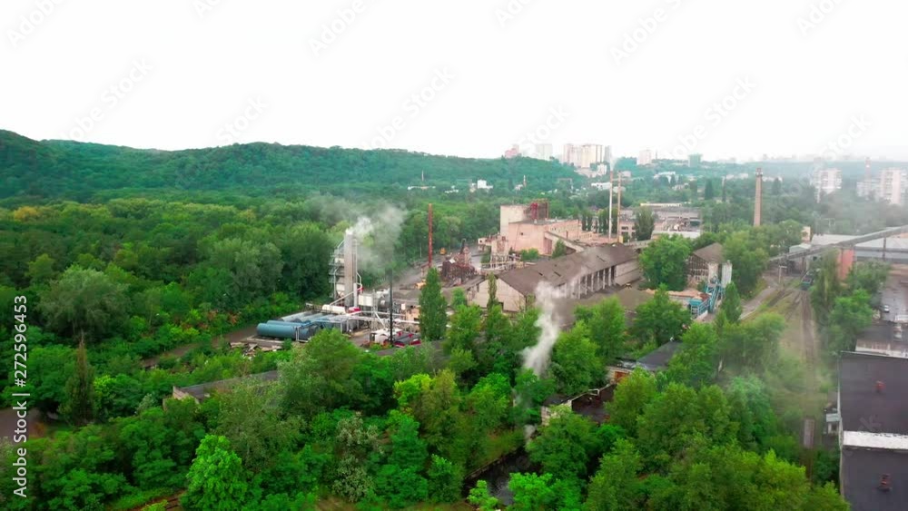 4K, Drone, Birds eye view of an industrial park with heavy machinery. 4K, Drone, Birds eye view of an industrial park with heavy machinery.