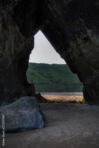 The passageway from the river area to the sea, only useable at low tide, at Three Cliffs Bay on the Gower peninsula in Swansea, South Wales, UK