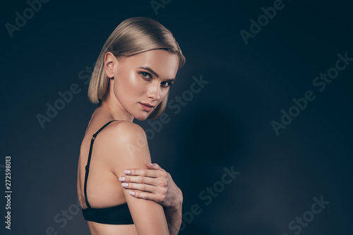Close up side profile view photo beautiful she her lady cunning satisfaction pleasure mistress hold hand arm shoulder dark silky bra tenderness skinny slim shape isolated black grey background
