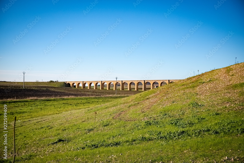 Historic railroad stone arch bridge near Spinazzola. Murgia, Apulia region, Italy Historic railroad stone arch bridge near Spinazzola. Murgia, Apulia region, Italy