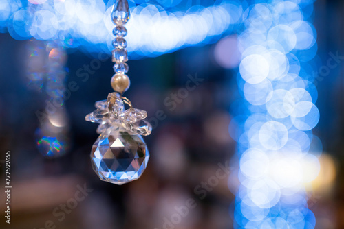 Crystal Christmas decoration isolated in blue bokeh balls backgr © CrispyMedia